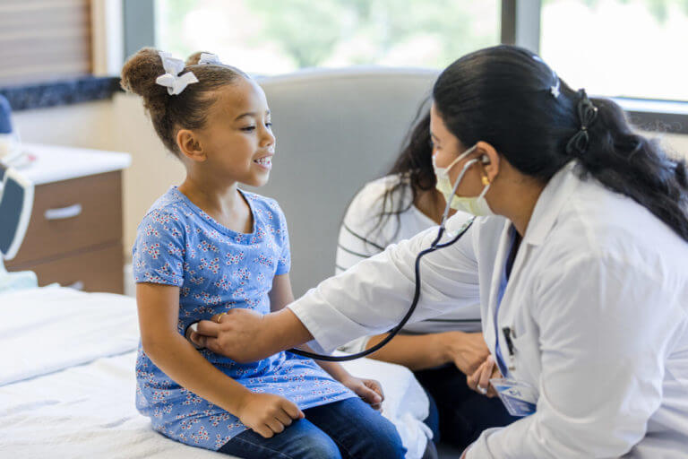 Nurse Practitioner Checking Kids Health
